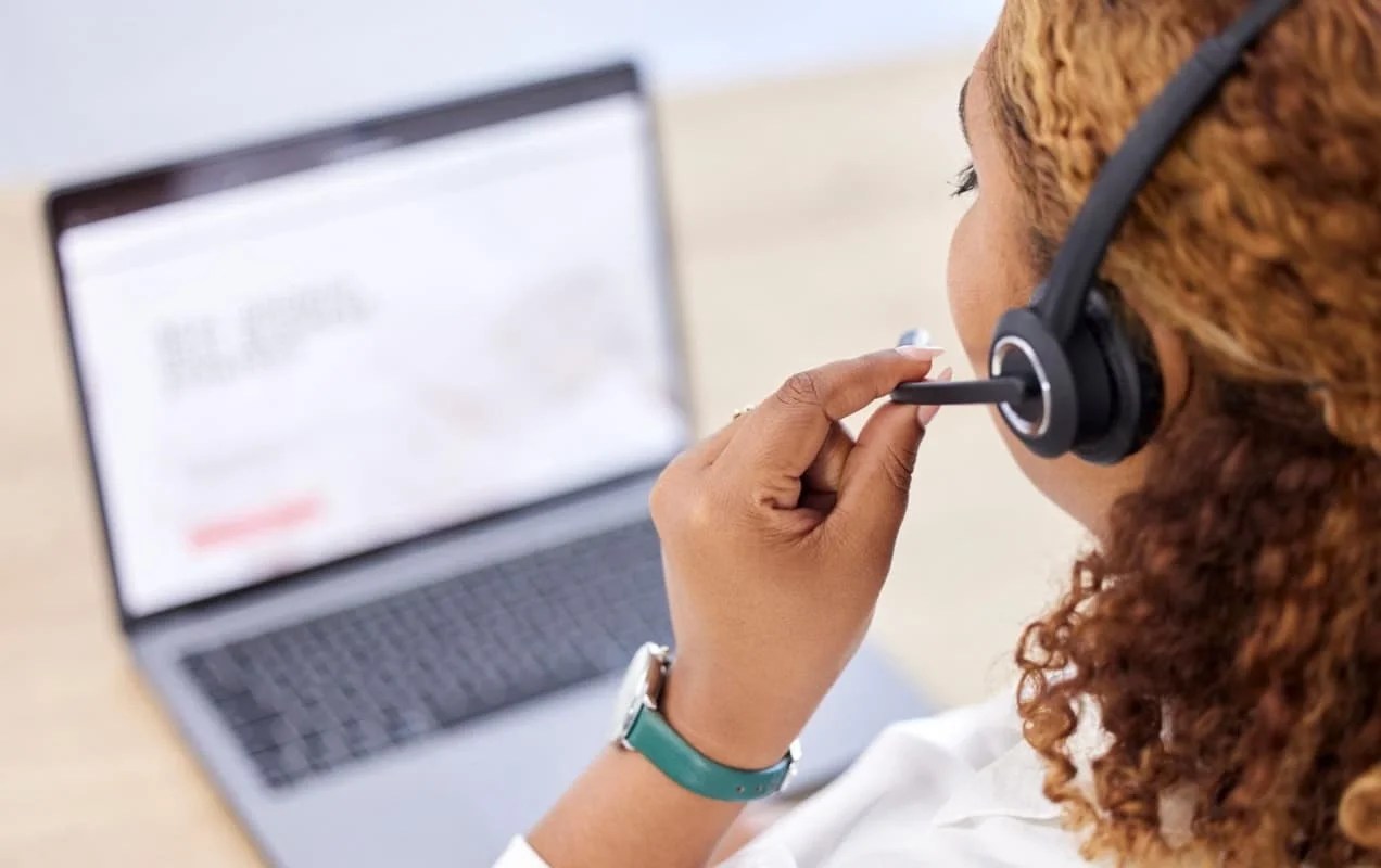 woman talking into a microphone on a customer service call