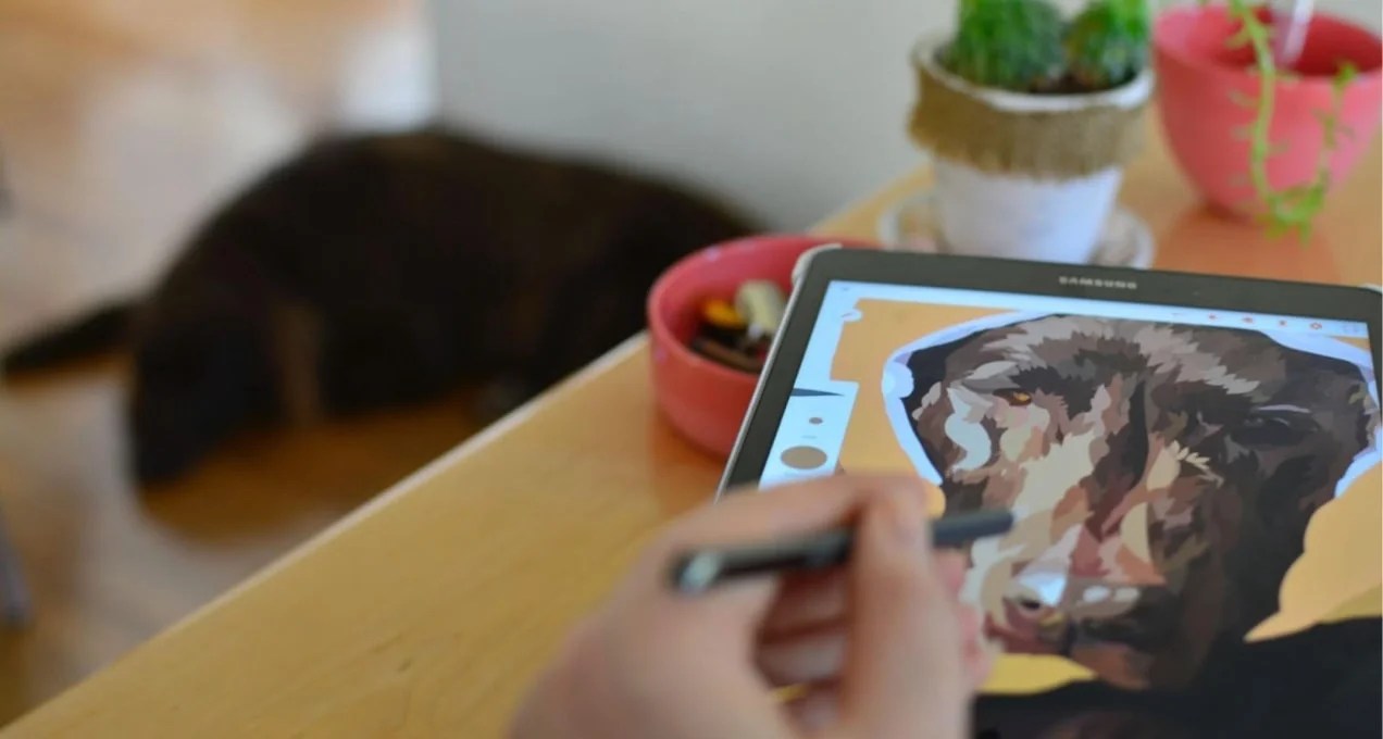 artist working on a digital painting of a dog