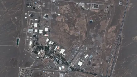 Getty Images / Maxar Technologies. Maxar satellite imagery shows multiple buildings destroyed at the Natanz enrichment facility following recent airstrikes.