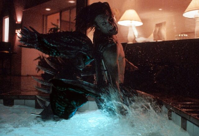 man being killed in a hot tub by an insectozoid alien creature.