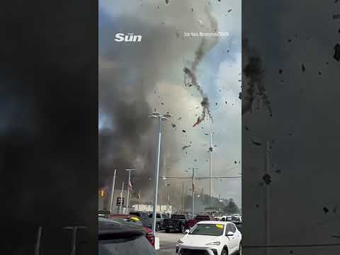 Moment gas explosion sparked by car crash blows roof off vet's clinic