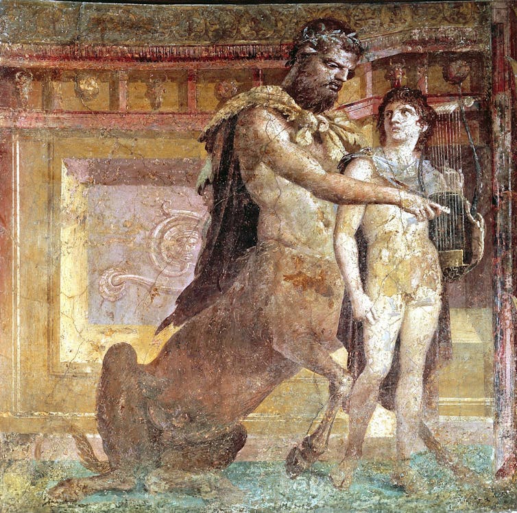 Painting of a centaur teaching a boy to play the lyre.