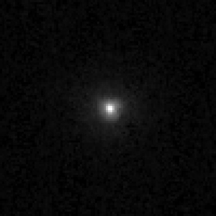 A black background with a fuzzy, white blob in the centre.