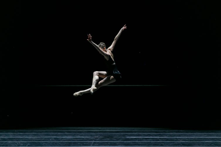 A woman in a stunning leap.