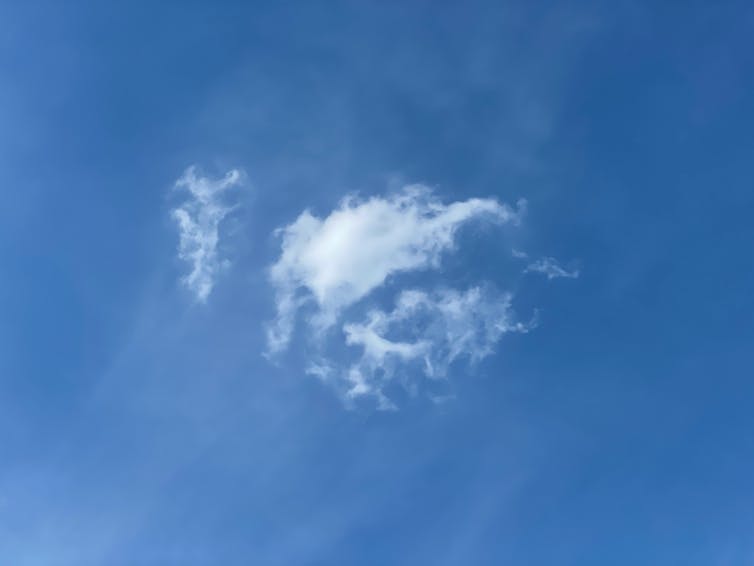 single white cloud blue sky.