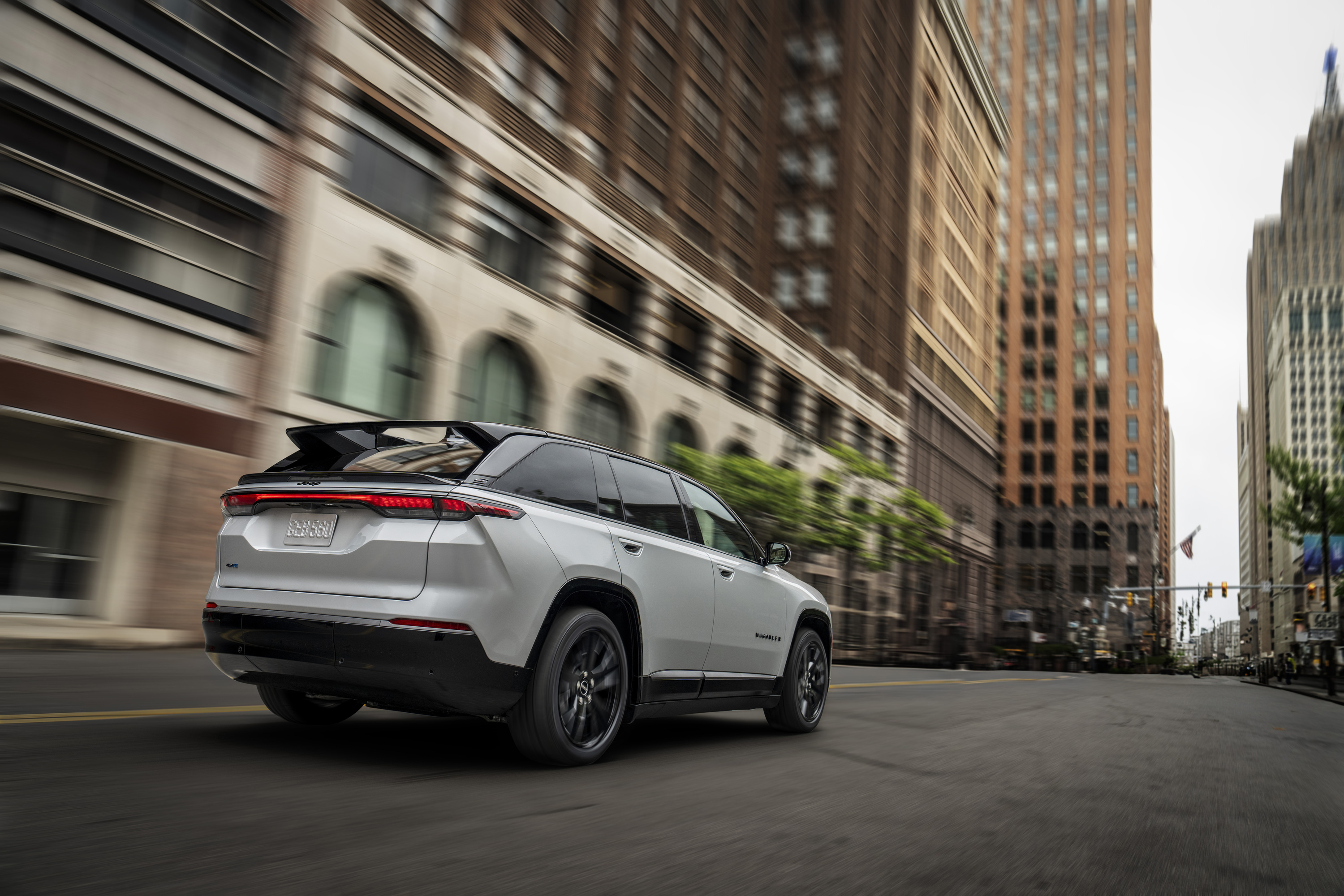 A Jeep Wagoneer S drives away from the camera