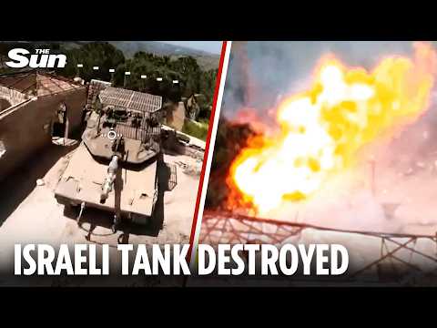 Moment Israeli tank bursts into flames as it's struck by a Hezbollah drone in Lebanon