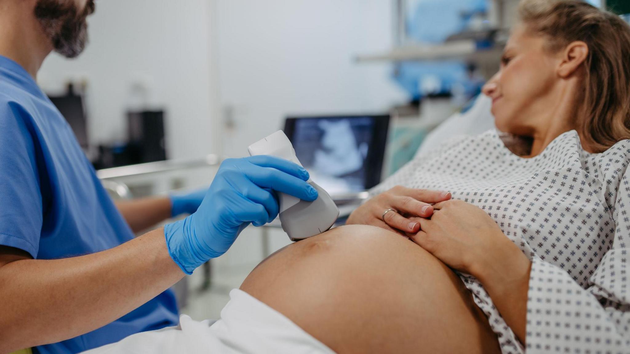 Stock photo of a pregnant woman being given an ultrasound scan.