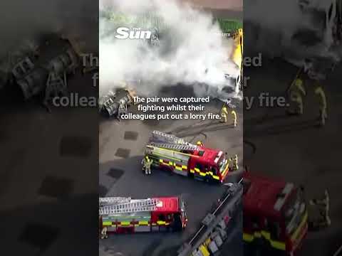 Moment firefighters FIGHT each other as they put out blaze