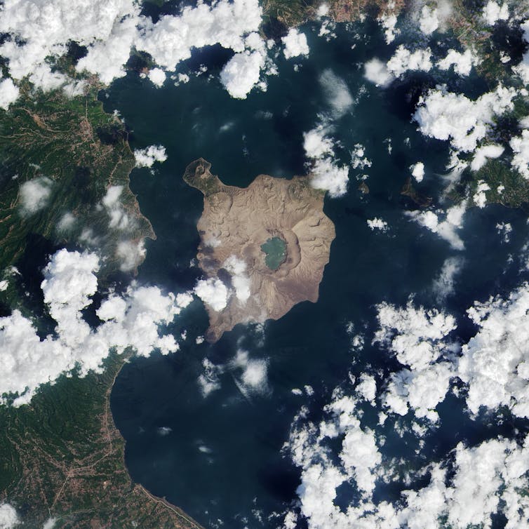 Aerial photo of an island in a lake.