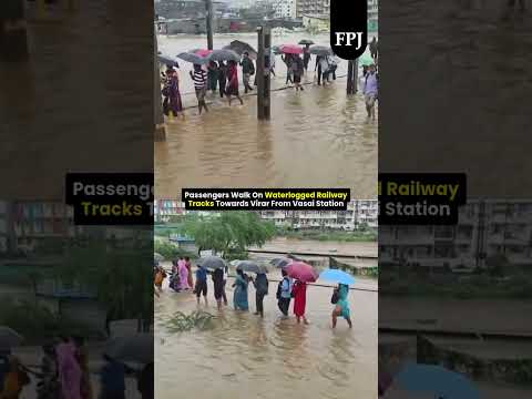 Passengers Walk On Waterlogged Railway Tracks Towards Virar From Vasai Station