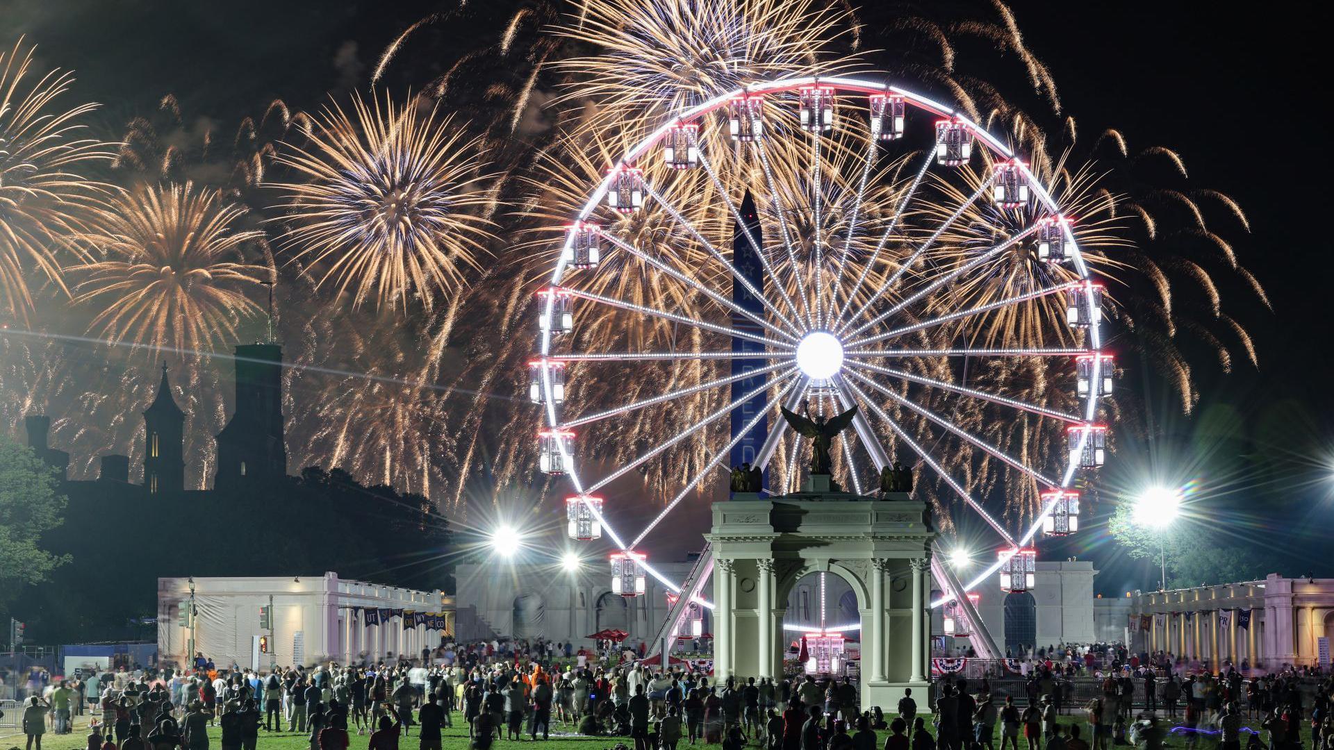 People watch a fireworks display that is attempting the largest firework display in history with 850,000 fireworks