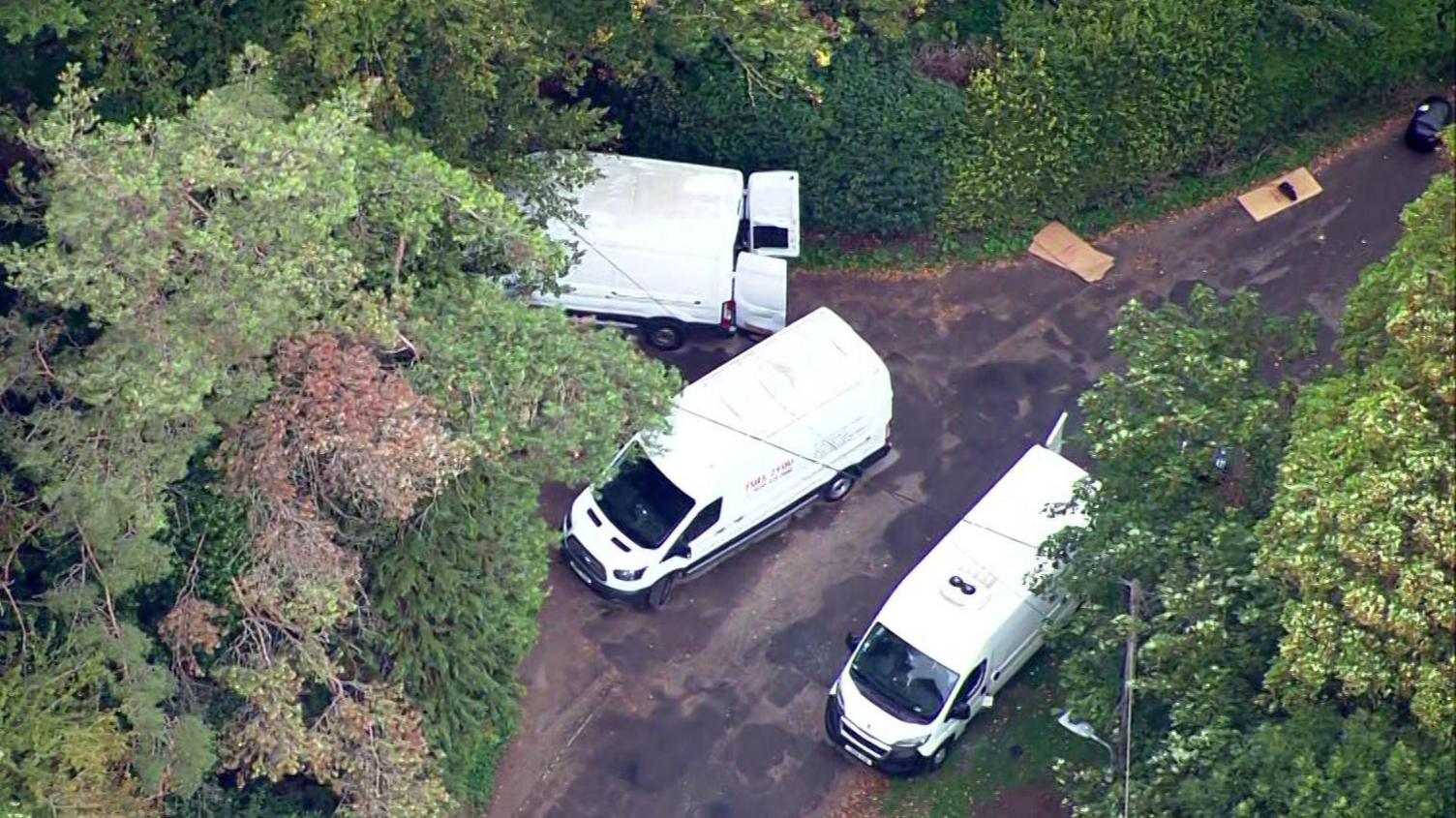 Aerial footage shows white vans in Whelford, near RAF Fairford.